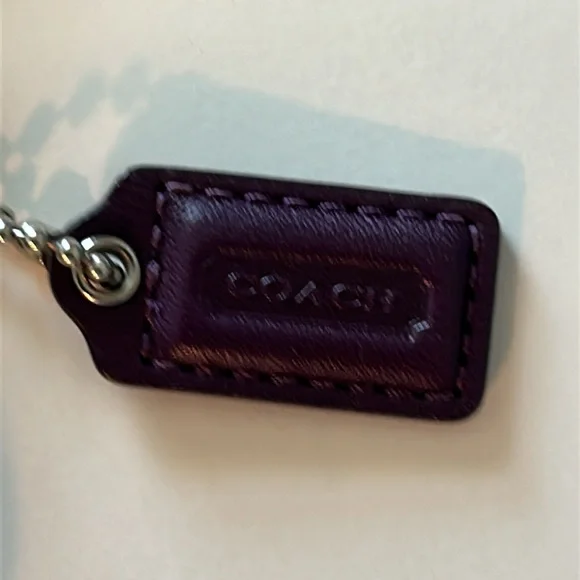 EUC Coach patent leather wristlet in dark purple or plum color and silver metal - Picture 6 of 10